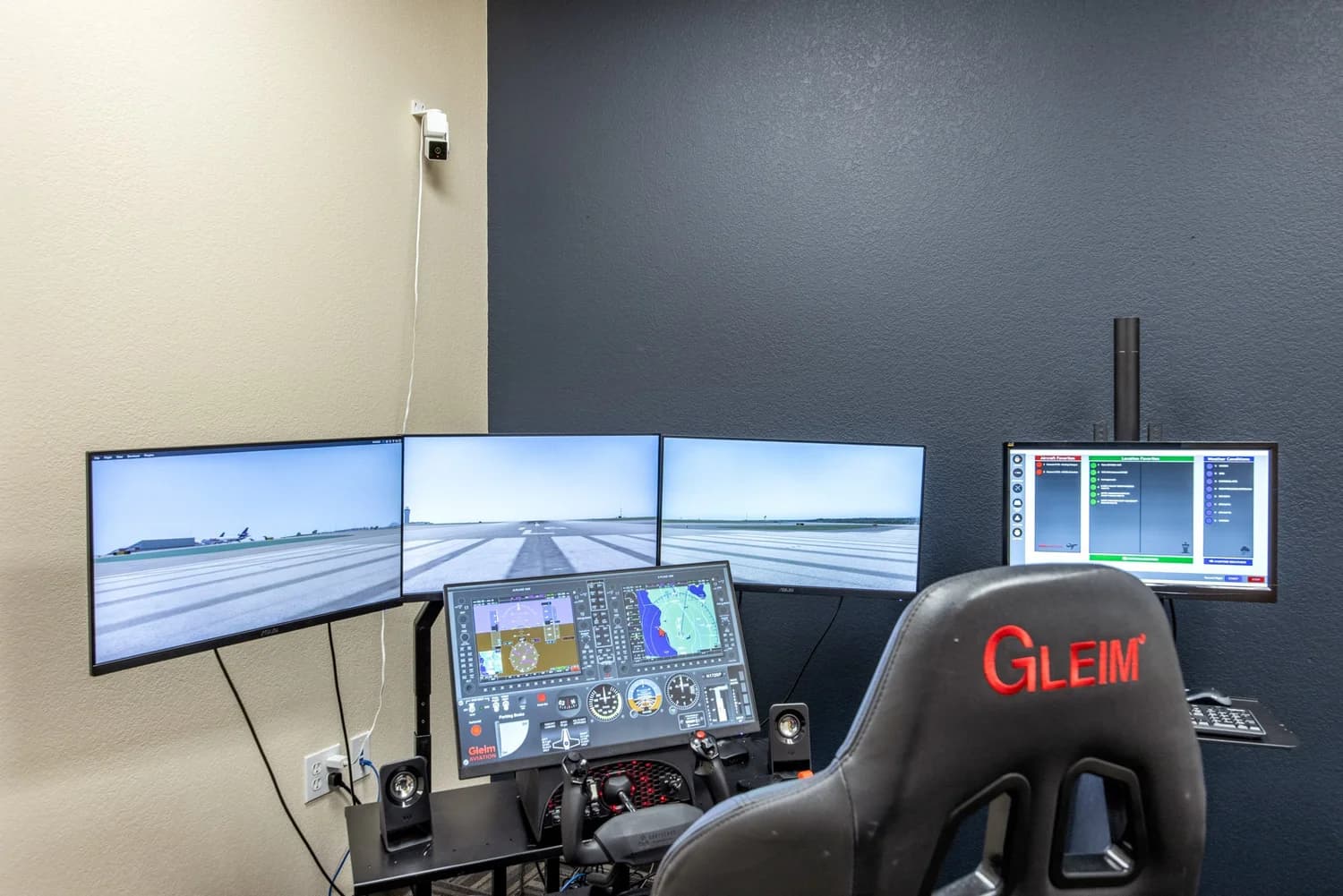 Gleim BATD-class Cessna 172 trainer in a private room — three landscape monitors showing a runway approach, glass-cockpit panel, yoke and rudder pedals, with a Gleim sport seat