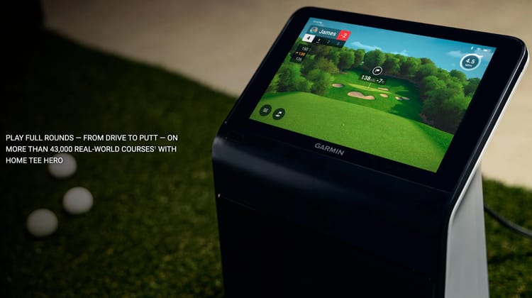 Garmin Approach R50 outdoors in a tee box — touchscreen showing a real-world golf hole render with player scorecard